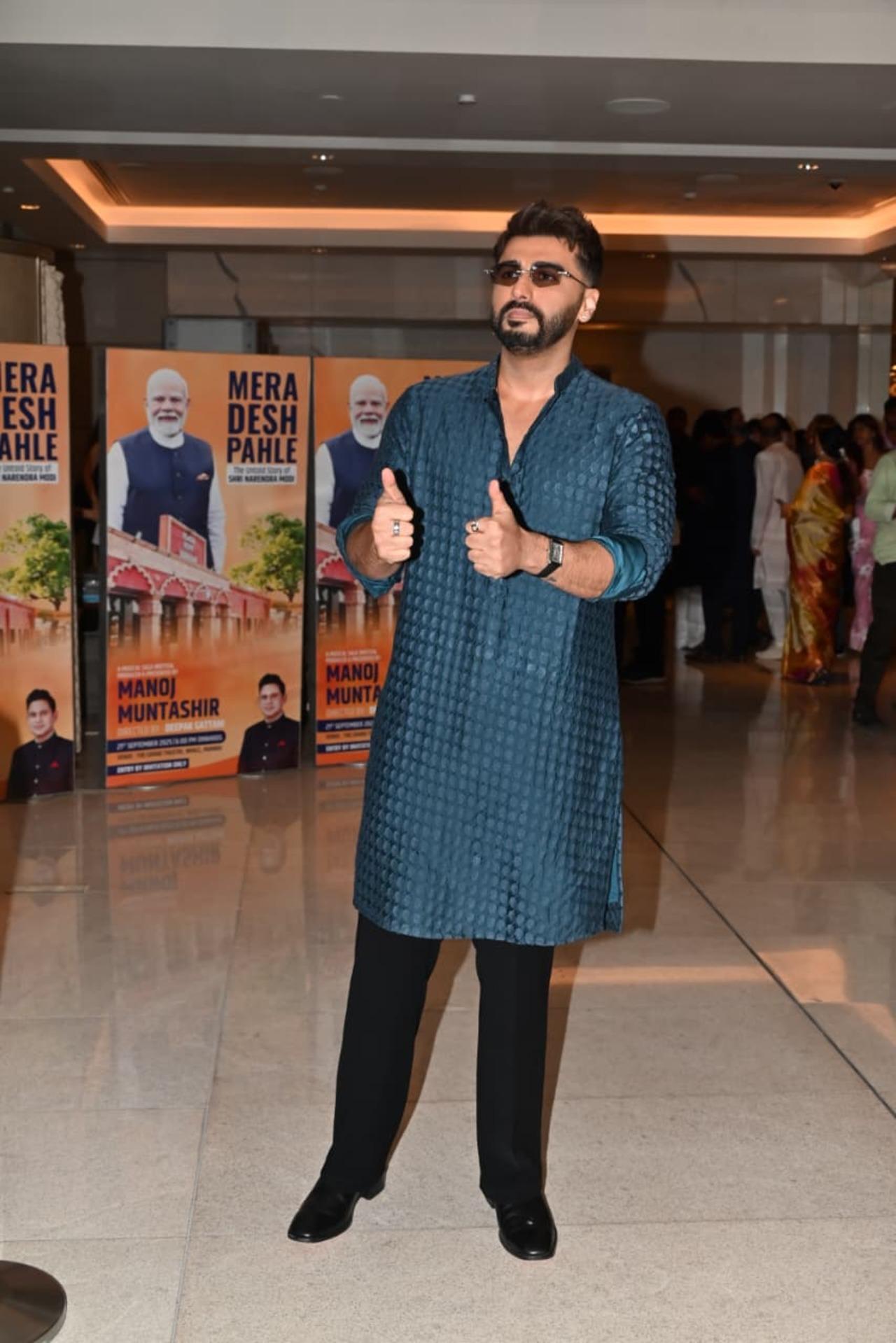 Arjun Kapoor made heads turn in a dark green kurta with black bottoms. He completed the look with cool shades and posed for the paps. 